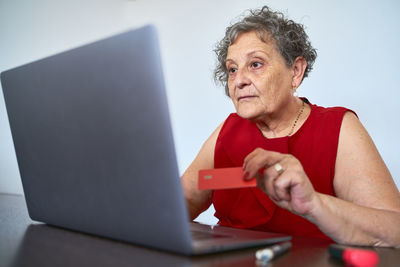 Portrait of woman using mobile phone