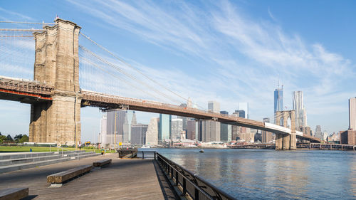 Brooklyn bridge over east river against sky