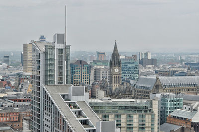 High angle view of buildings in city against sky