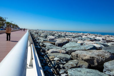 Panoramic view of sea against clear blue sky