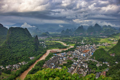 High angle view of landscape and city against sky