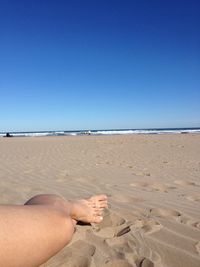 Scenic view of beach against clear sky