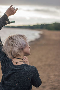 Rear view of woman at beach