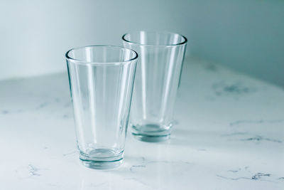 Close-up of water in glass against white background