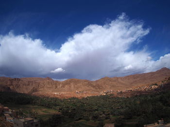 Scenic view of landscape and mountains against sky