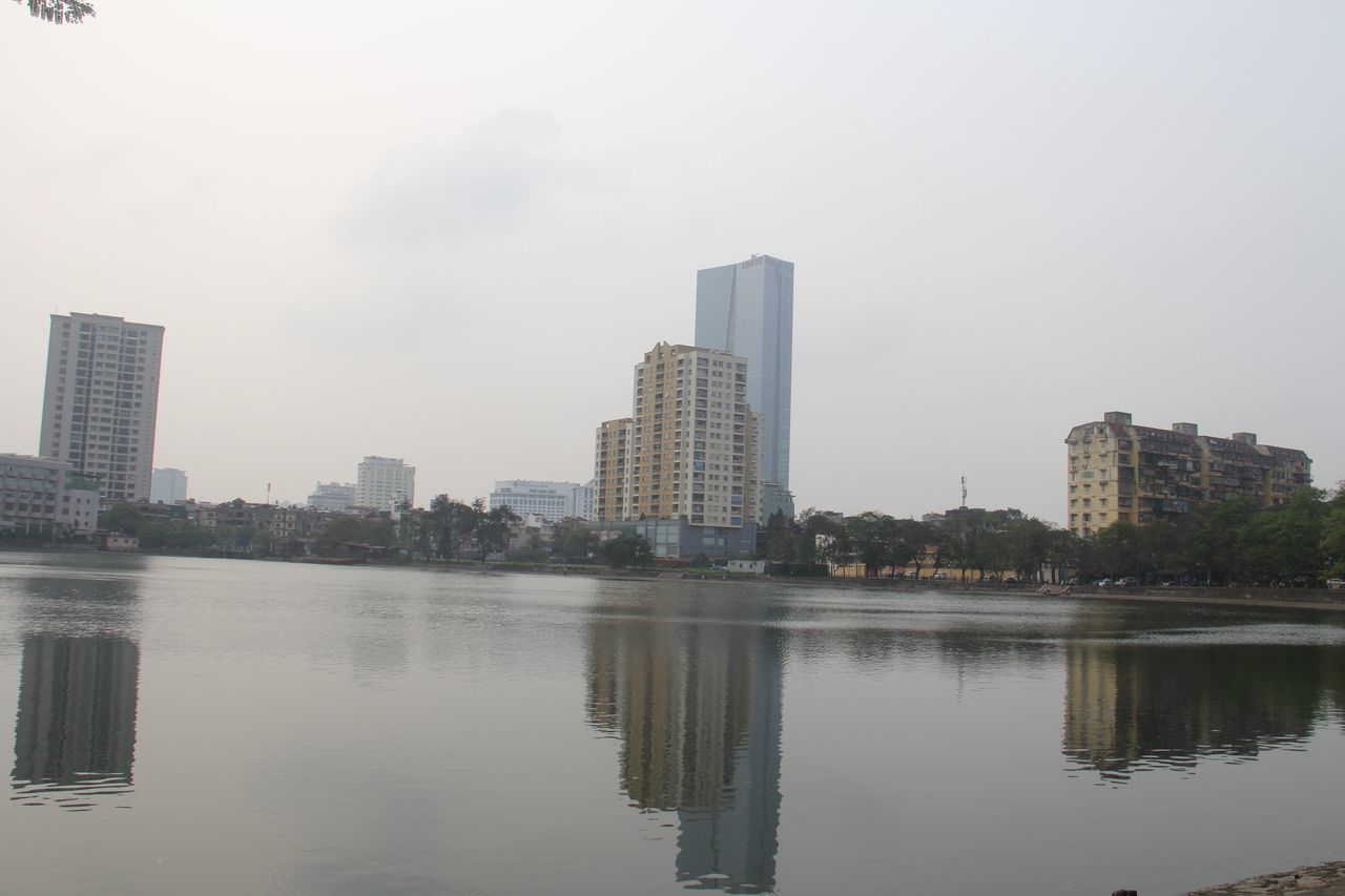building exterior, architecture, water, built structure, city, waterfront, reflection, sky, skyscraper, river, tall - high, lake, tower, cityscape, building, modern, office building, urban skyline, outdoors, day