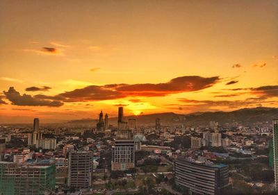 Aerial view of cityscape during sunset