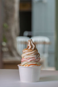 Close-up of ice cream cone on table