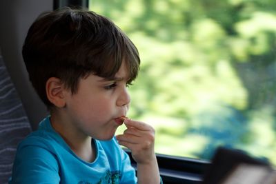 Close-up of boy eating