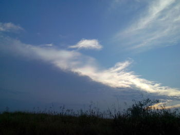 Scenic view of landscape against blue sky