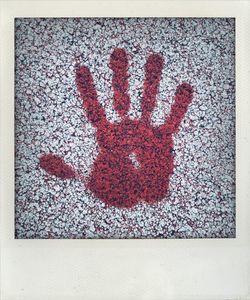 High angle view of text on human hand