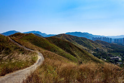 Scenic view of mountains against blue sky