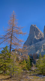 Scenic view of mountains against clear blue sky