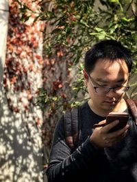 Portrait of man using mobile phone