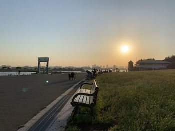 Scenic view of landscape against clear sky during sunset