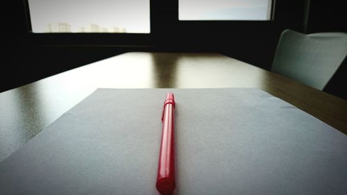 Close-up of paper on table at home
