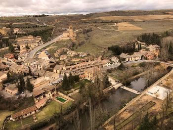 High angle view of river amidst buildings in city