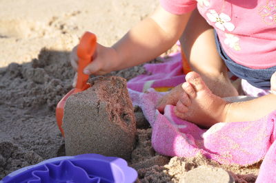 Low section of child on beach