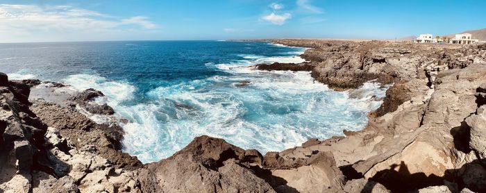 Panoramic view of sea shore against sky