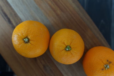 High angle view of oranges on cutting board