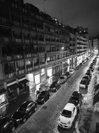 High angle view of traffic on road amidst buildings in city