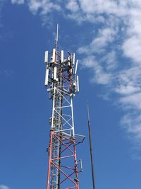 Low angle view of communications tower against sky