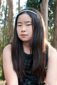 Portrait of young woman in forest