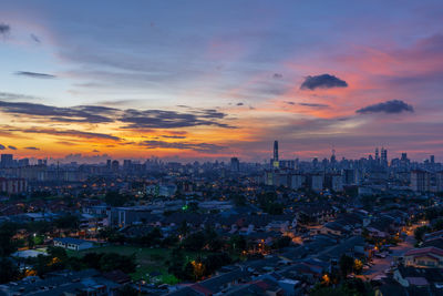 High angle view of city during sunset