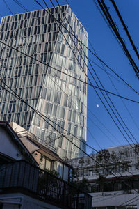 Low angle view of modern building against sky