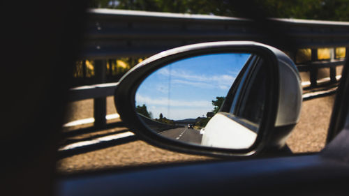 Reflection of car on side-view mirror