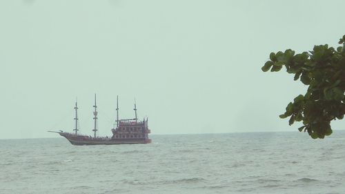 Ship in sea against clear sky