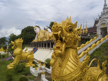 Statue of temple against building