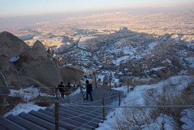 High angle view of people walking on steps at cappadocia during winter