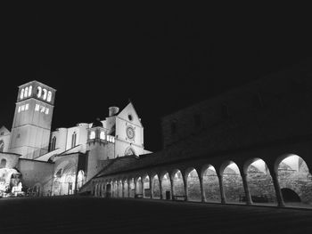 Low angle view of illuminated building against sky at night