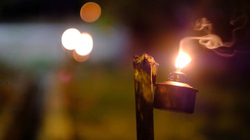 Close-up of burning candles