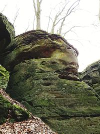 Low angle view of rocks against sky