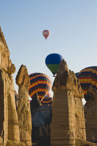 Low angle view of hot air balloons against sky