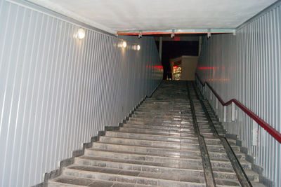 Rear view of man on staircase in building