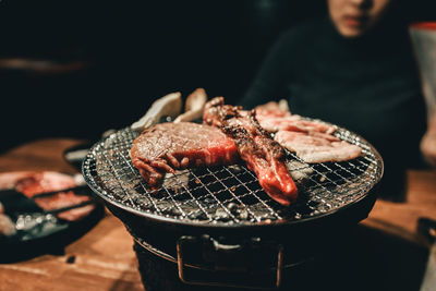 Close-up of meat on barbecue grill