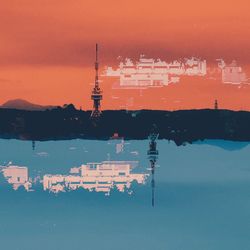 Sailboats in sea at sunset