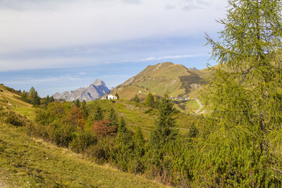 Scenic view of landscape and mountains against sky