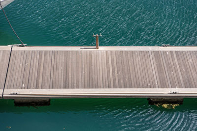 Close-up of pier over sea