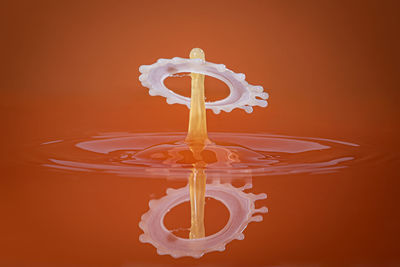 Close-up of water splashing against illuminated background