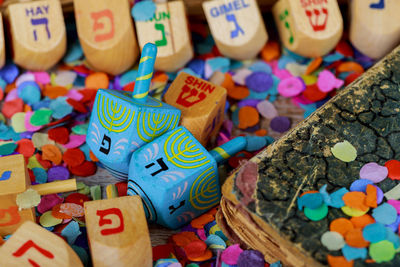 Close-up of colorful confetti on table during hanukkah