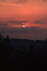 Scenic view of silhouette landscape against romantic sky at sunset