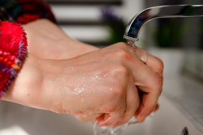 Washing hands in the bathroom