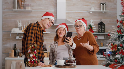 Group of people at christmas tree