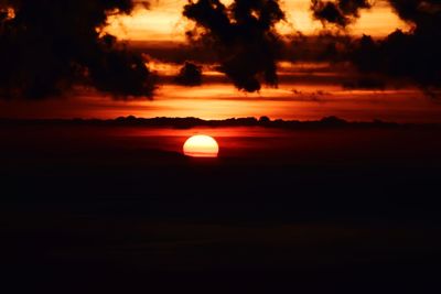 Scenic view of silhouette landscape against romantic sky at sunset