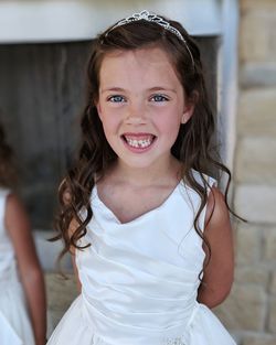 Portrait of smiling girl standing outdoors
