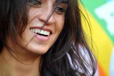 Close-up portrait of a smiling young woman